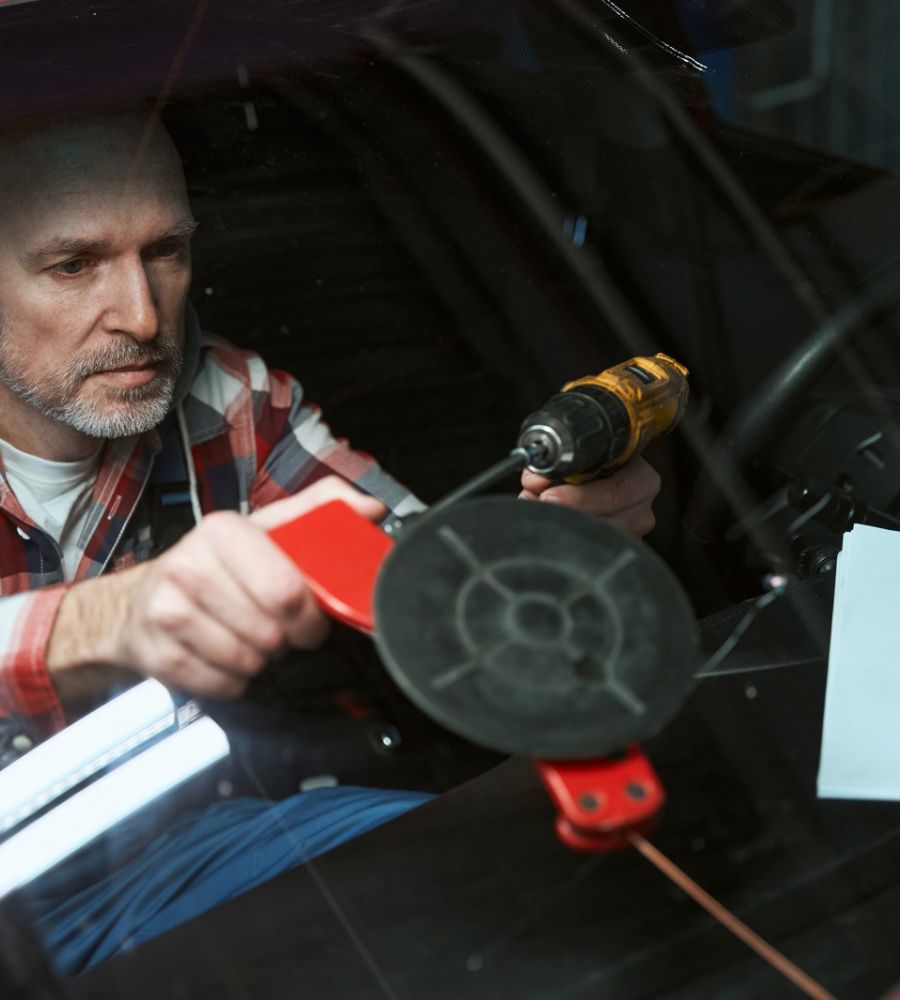 Auto Glass Repair Technician Installing New Windshield Tools Services