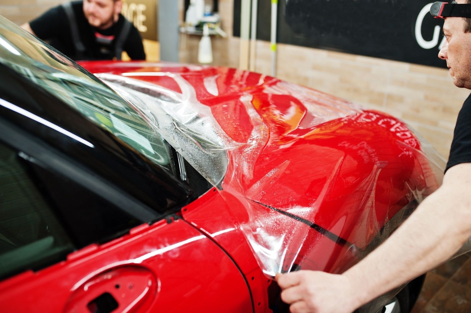 Ppf Gainesville Installing Paint Protection Film On Red Car