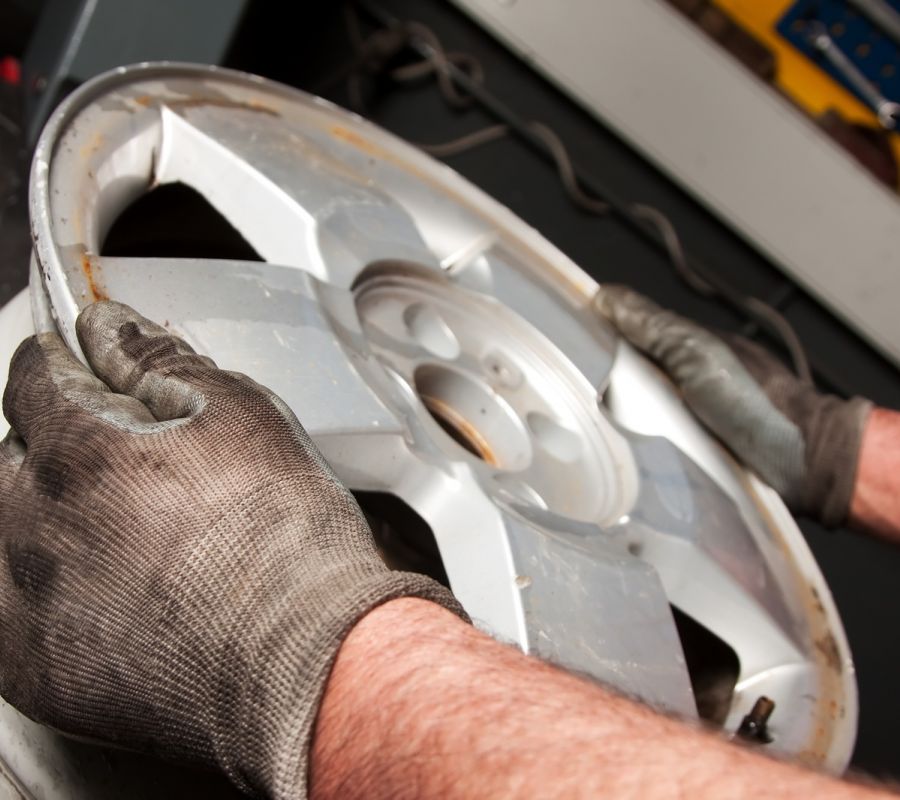 Wheel Repair Using Gloved Hands Centreville Wheel Replacement Service